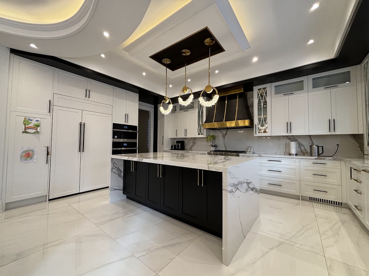 Gleaming white and black kitchen with island after a professional clean